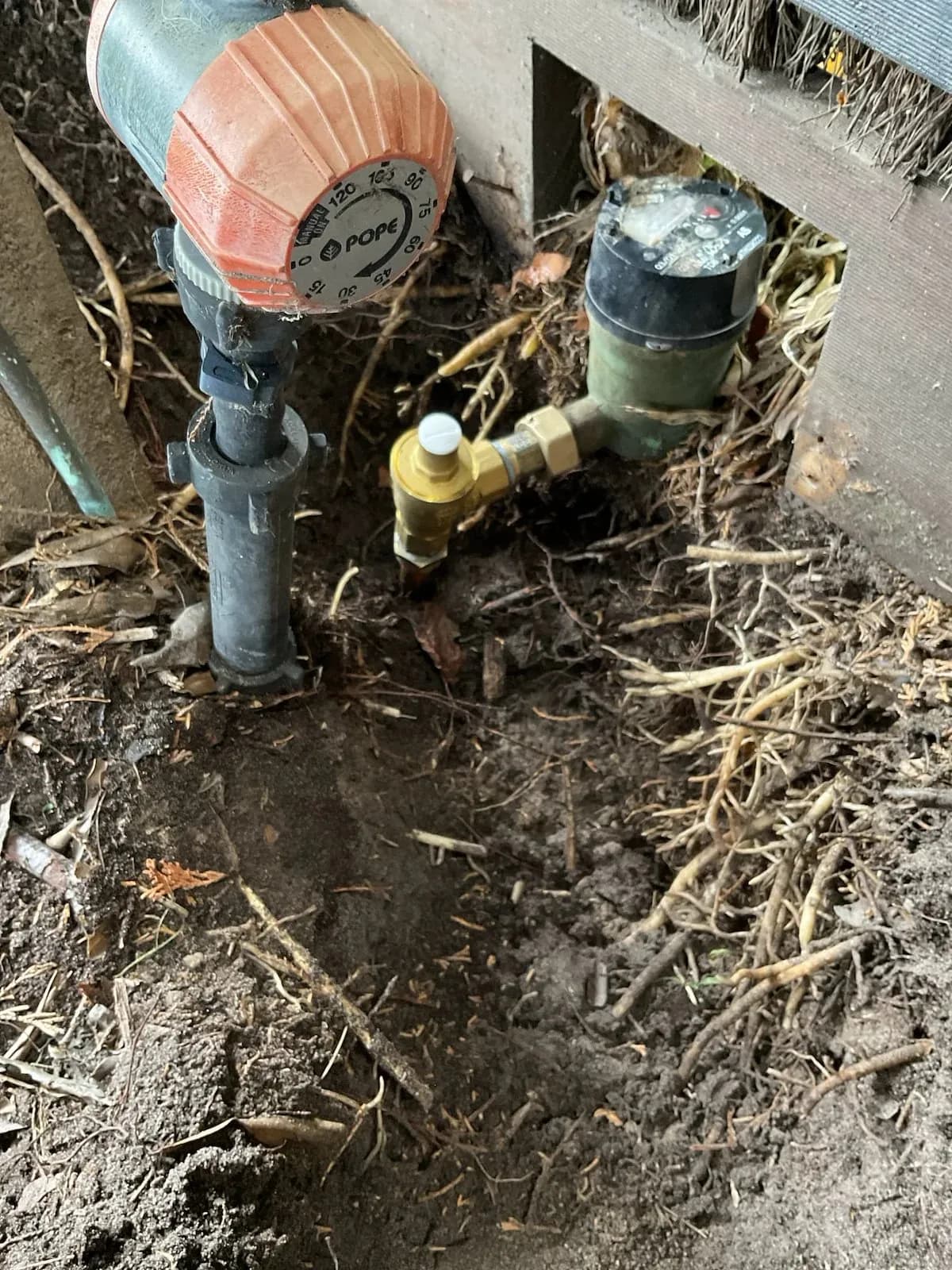 Water meter and new control valves beside the house