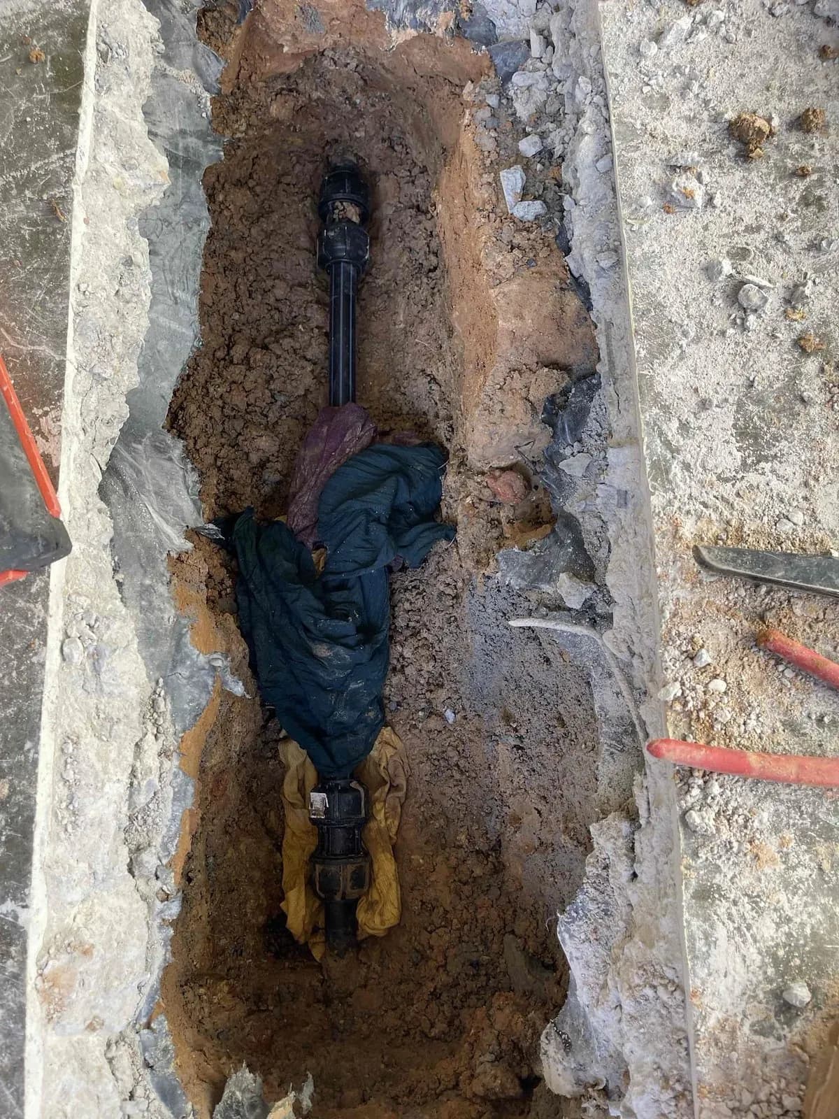 Leaking water pipe exposed under the slab