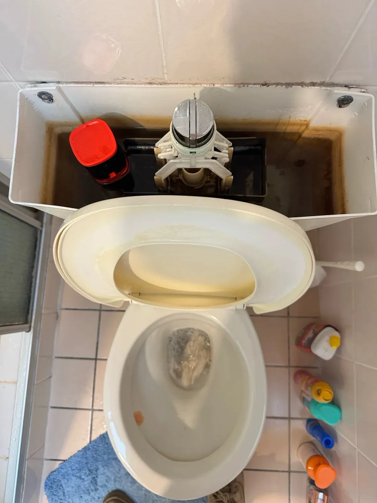 Toilet cistern open from above during the repair