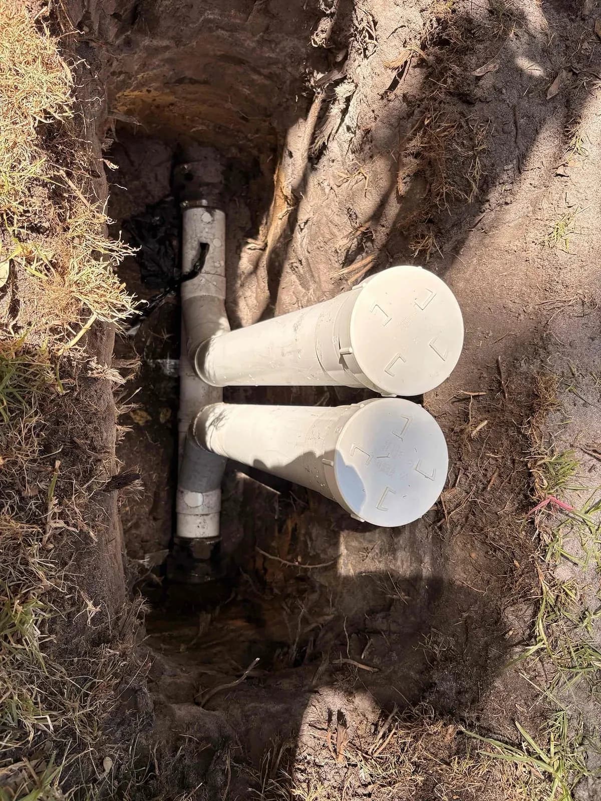 New PVC section and access points after a root-damaged sewer reline in Parkdale