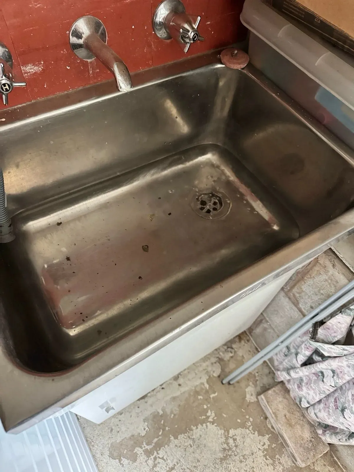 Laundry trough draining again after the sewer was cleared in Pearce