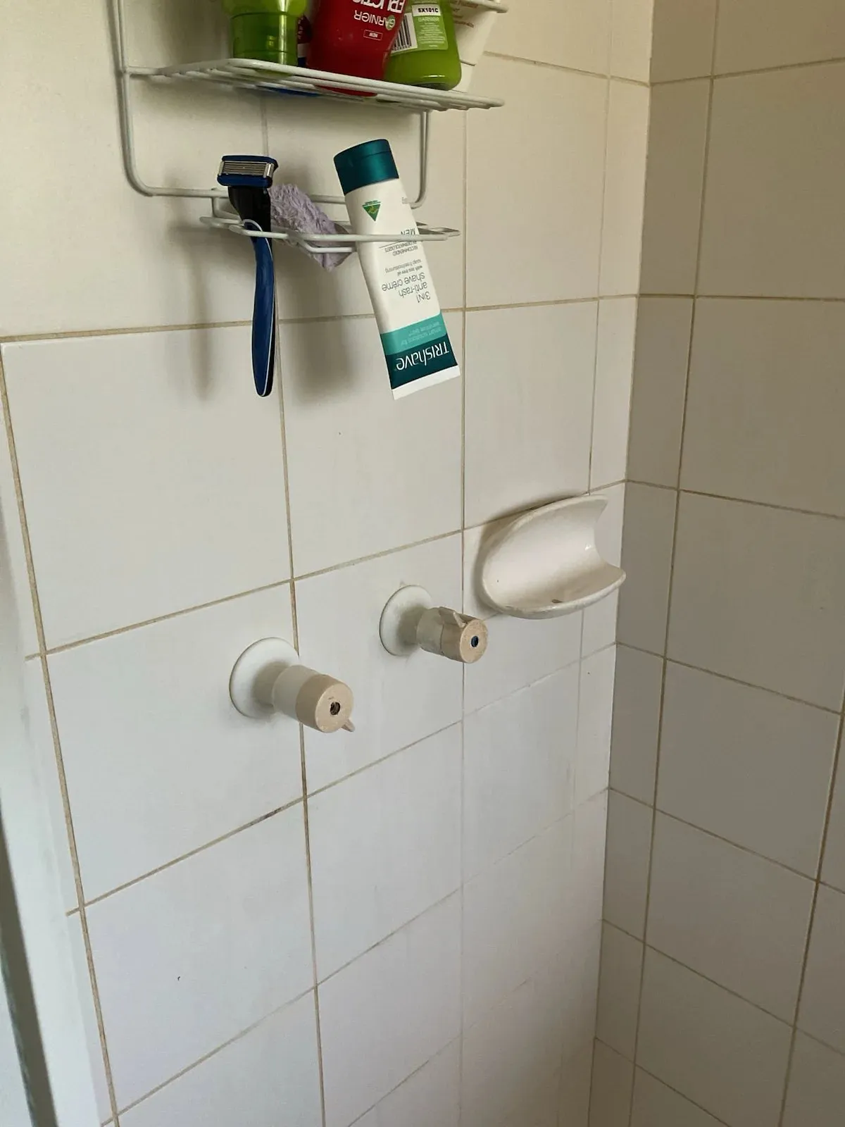 Shower wall with the old tap handles removed
