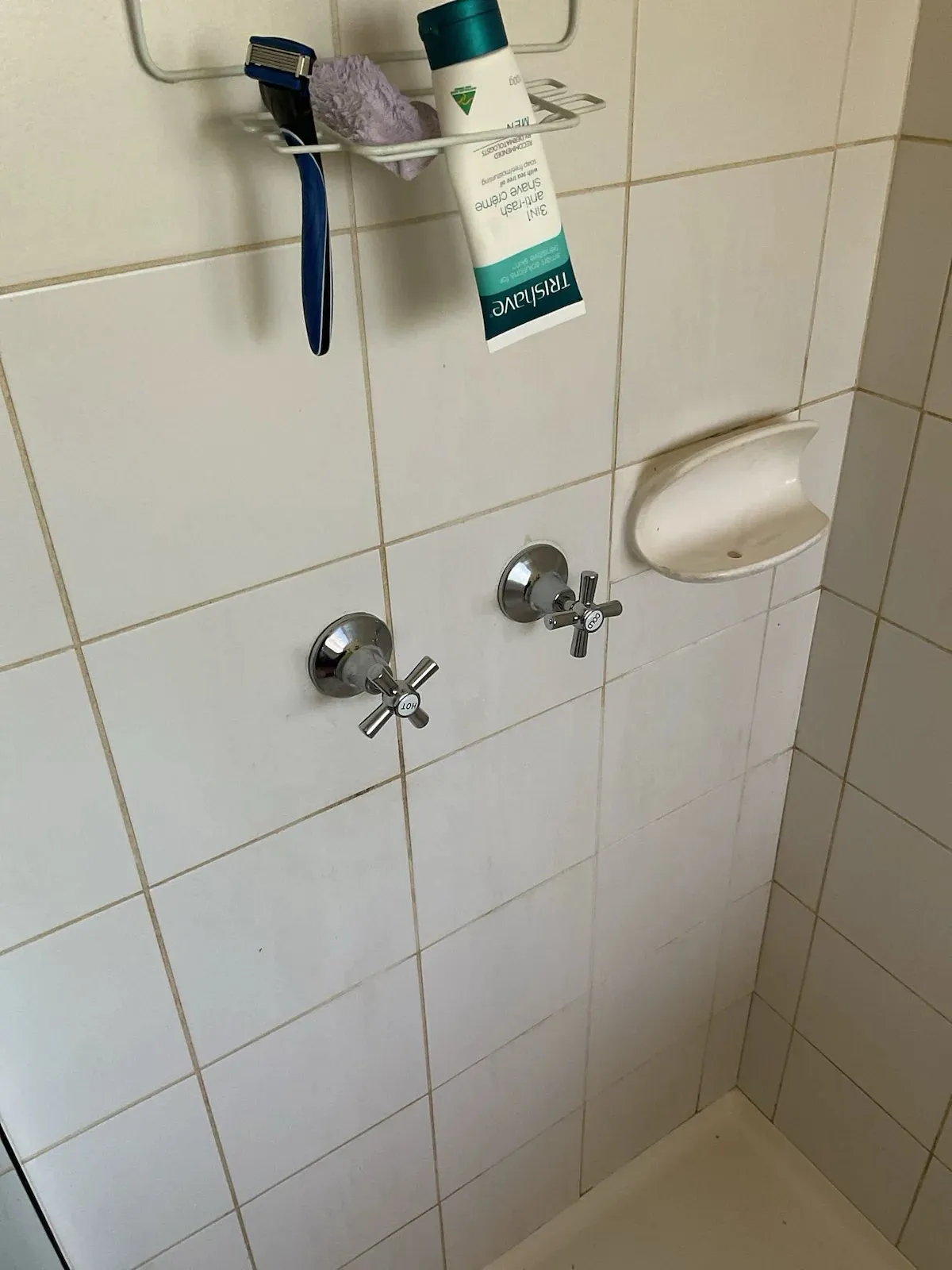 Shower wall with new tap handles fitted