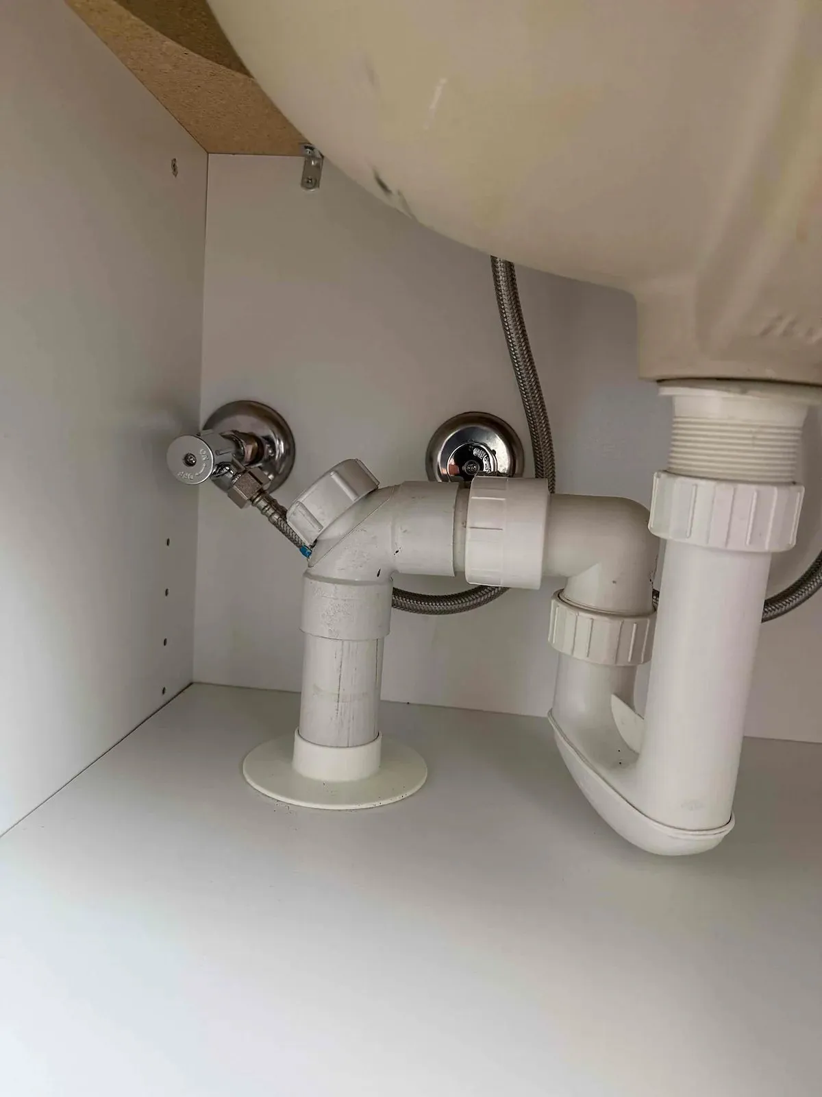 New basin taps and connections under the vanity