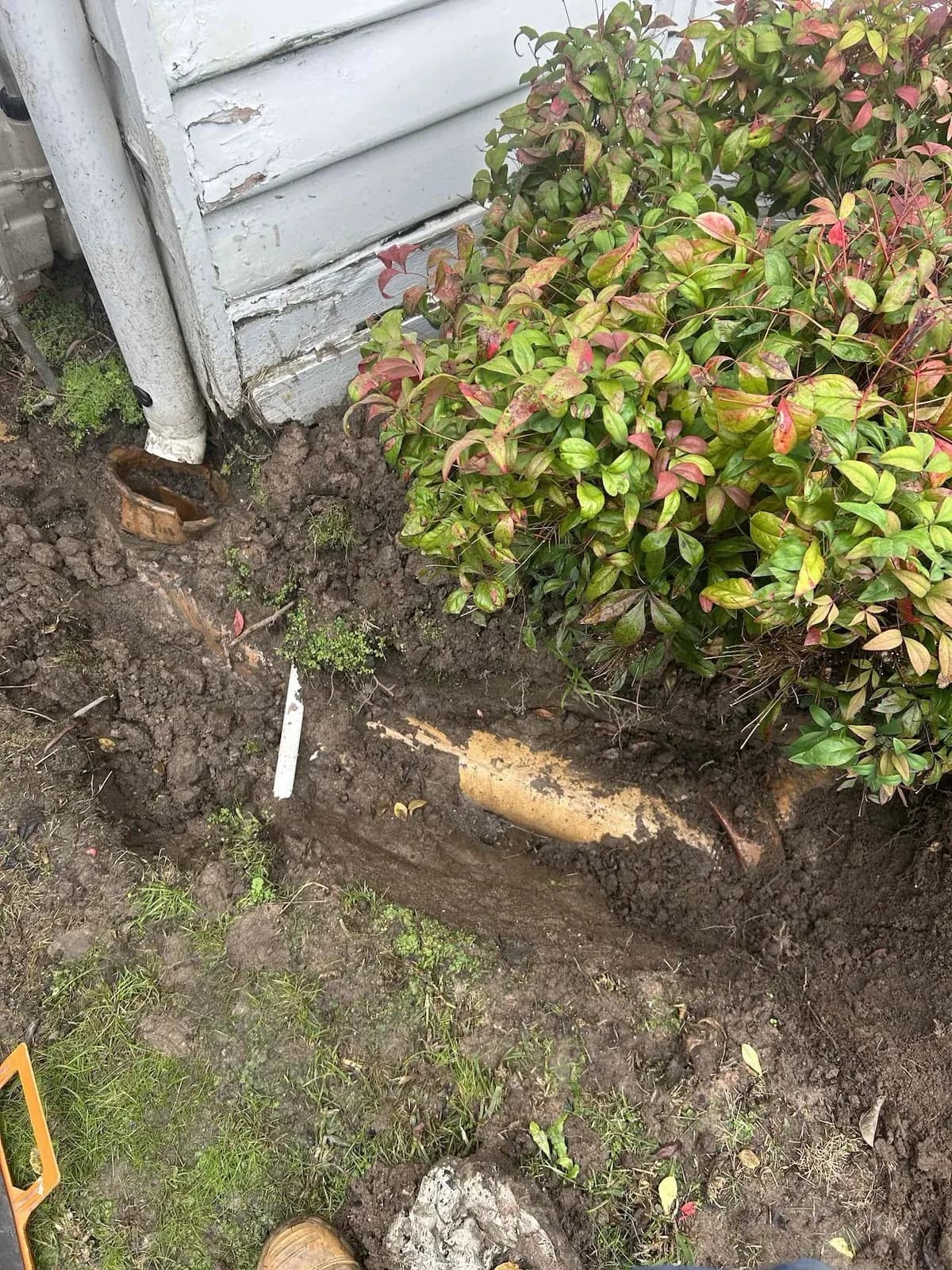 Broken pipe dug out beside the house