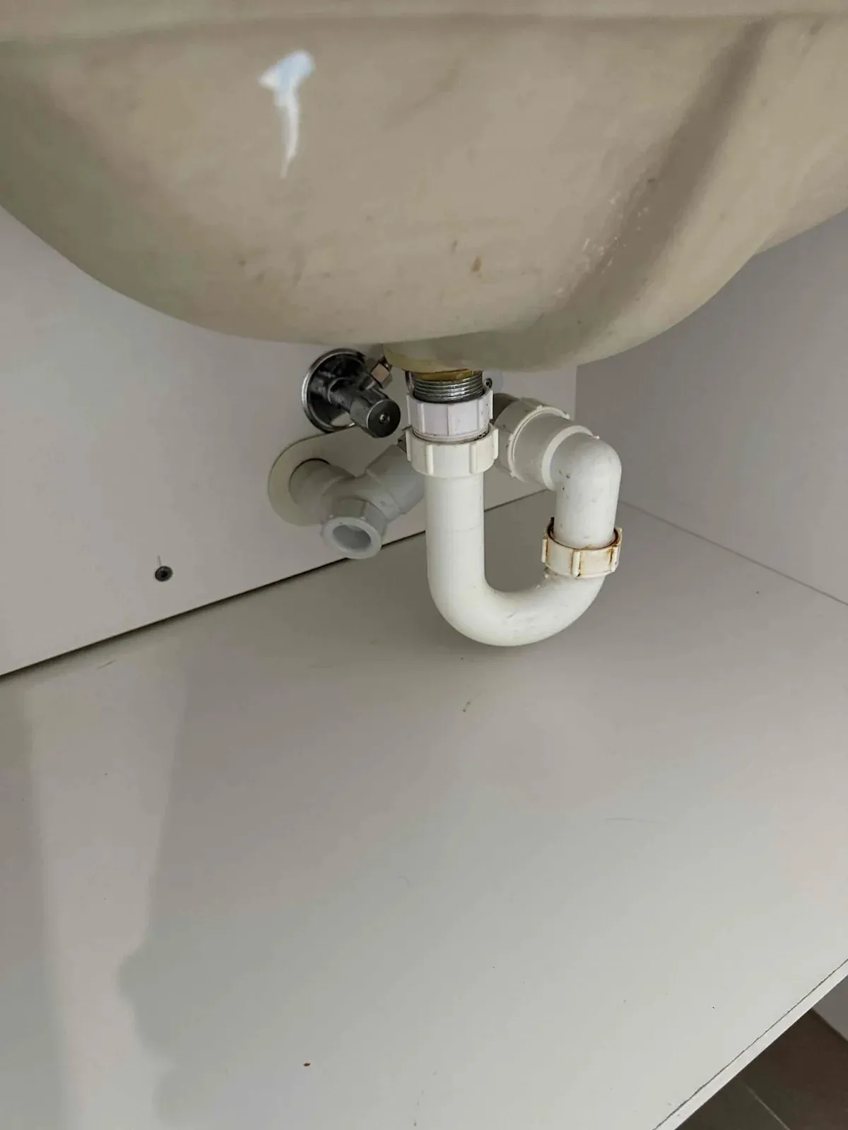 Basin waste and trap after the drain was cleared