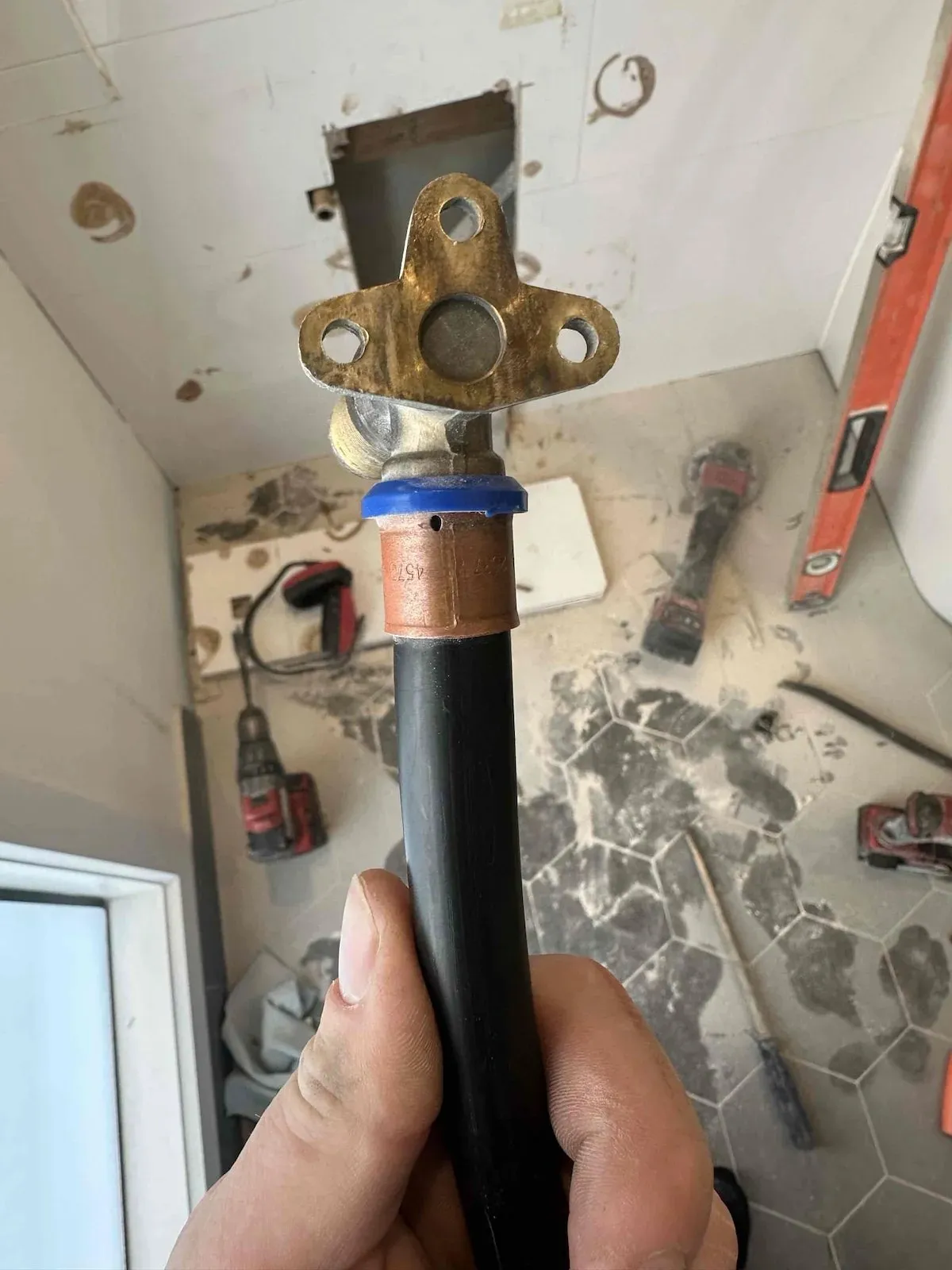 Leaking water pipe fitting removed from the wall