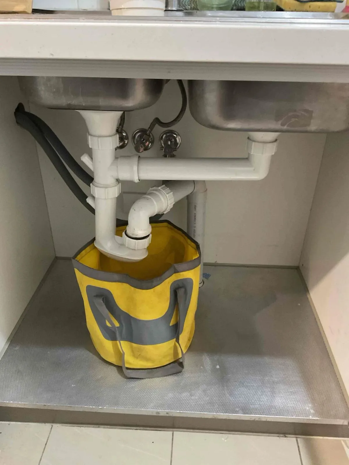 Kitchen sink waste pipes under the bench during the job