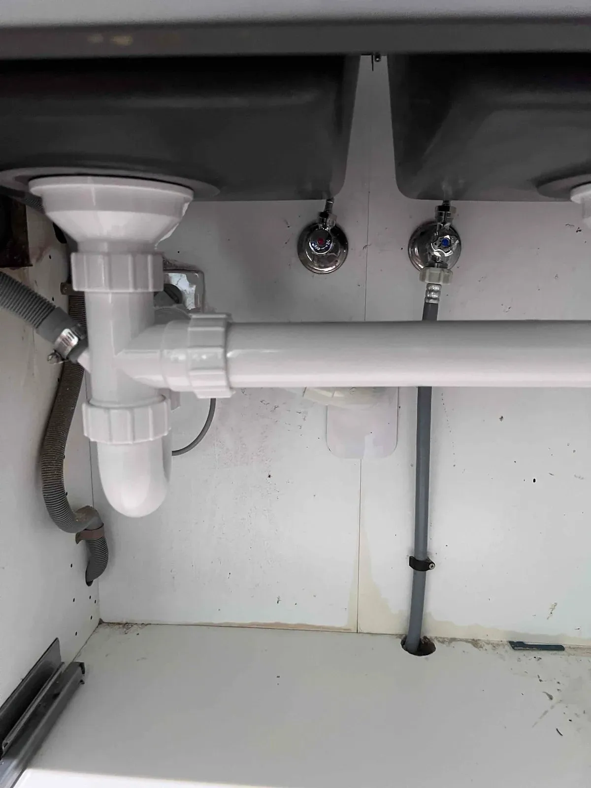 New sink tap connections and waste under the kitchen sink