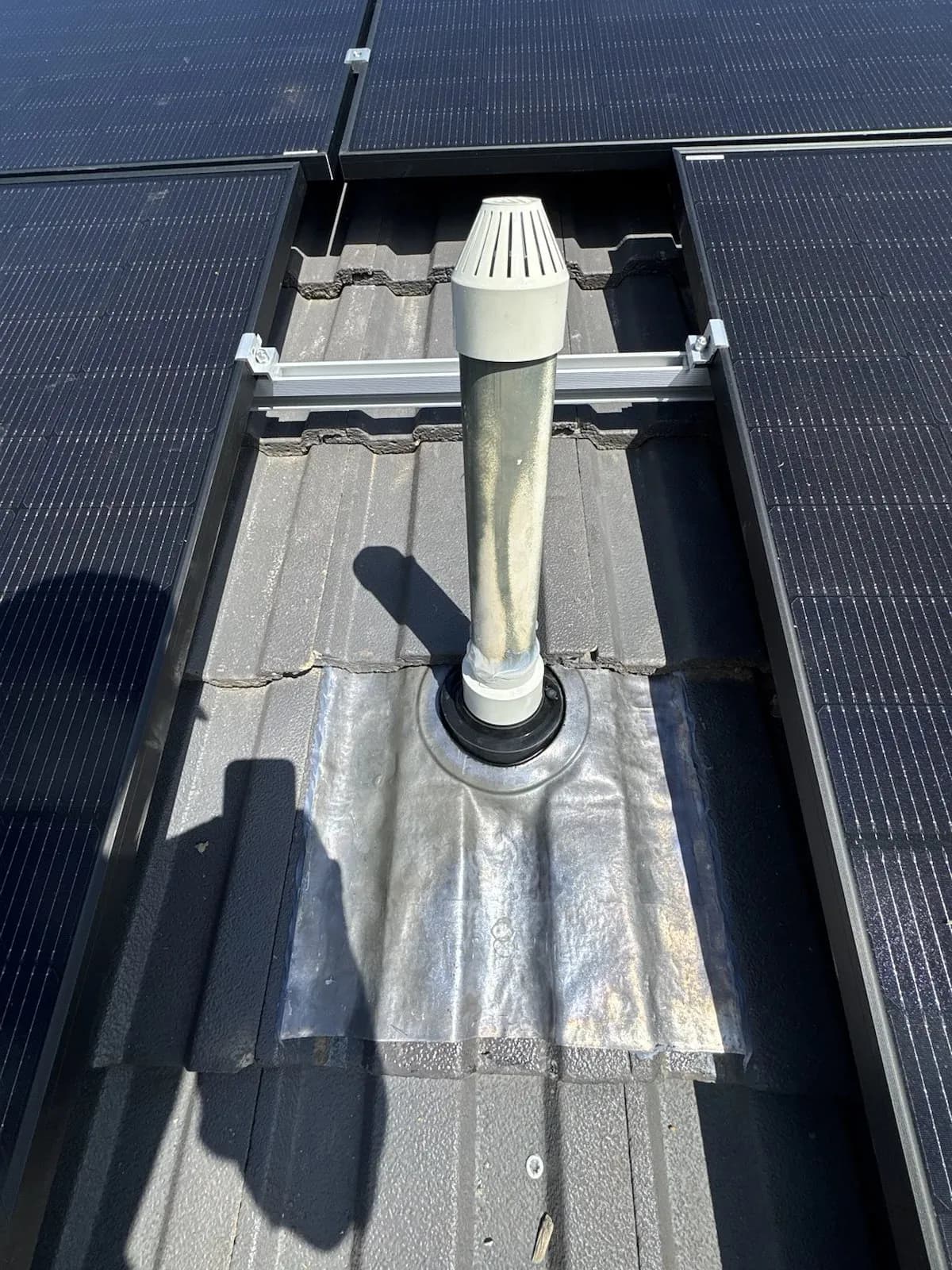 New flashing and weather cover fitted around the vent pipe