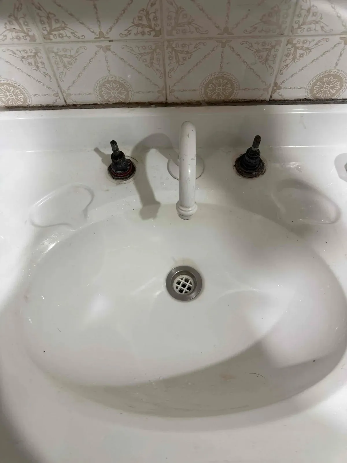 Basin taps stripped down before the rebuild
