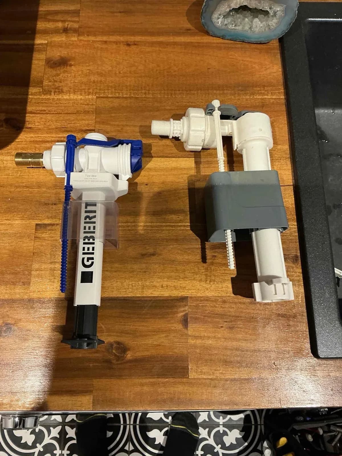 Old and new toilet inlet valves side by side