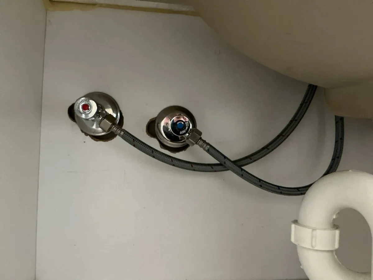 New isolation taps and hoses under the basin
