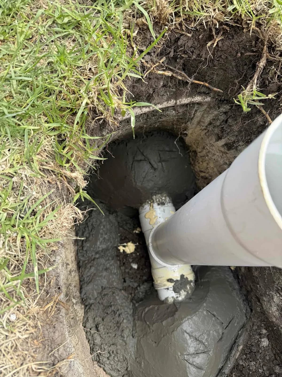 Repaired stormwater junction set in concrete