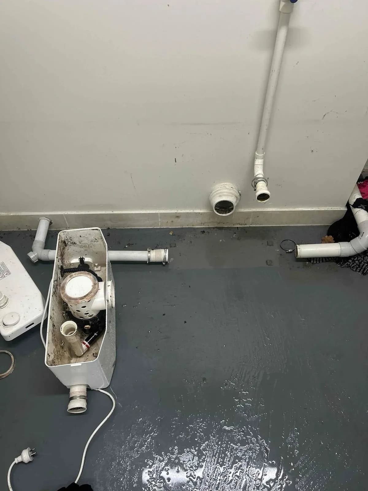 Basement macerator pump opened up and packed with waste