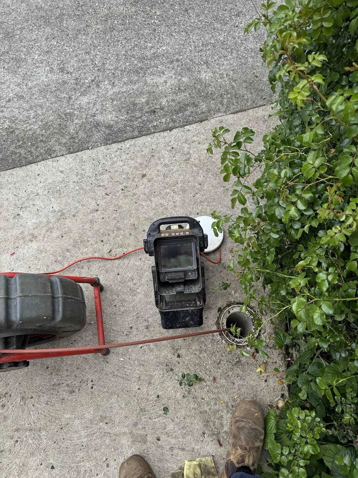 Drain camera and machine set up at the inspection opening