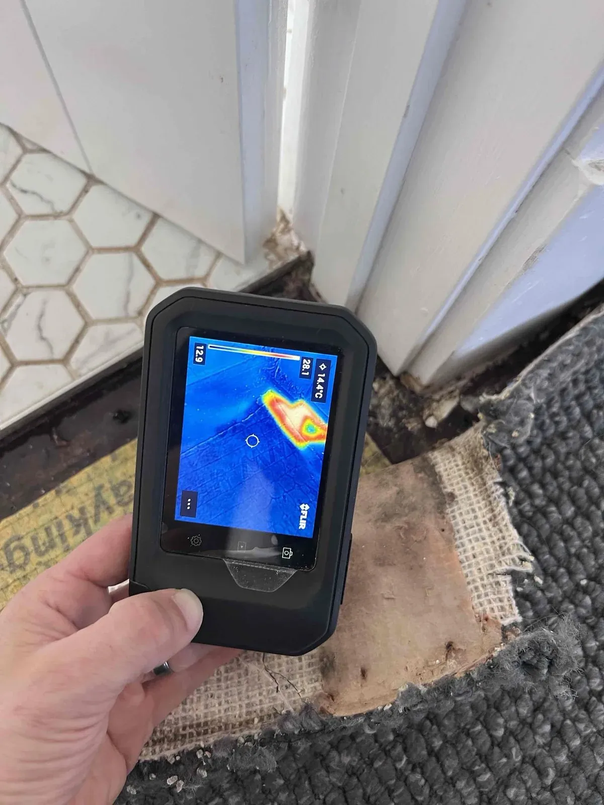 Thermal camera showing moisture under the upstairs shower