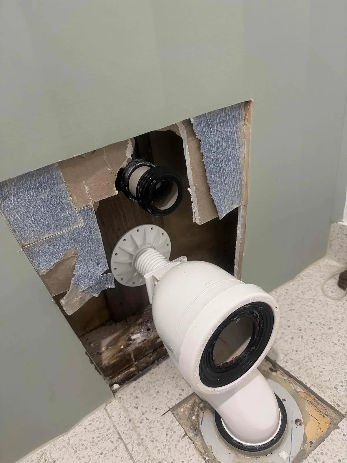 In-wall toilet removed with the wall opened up