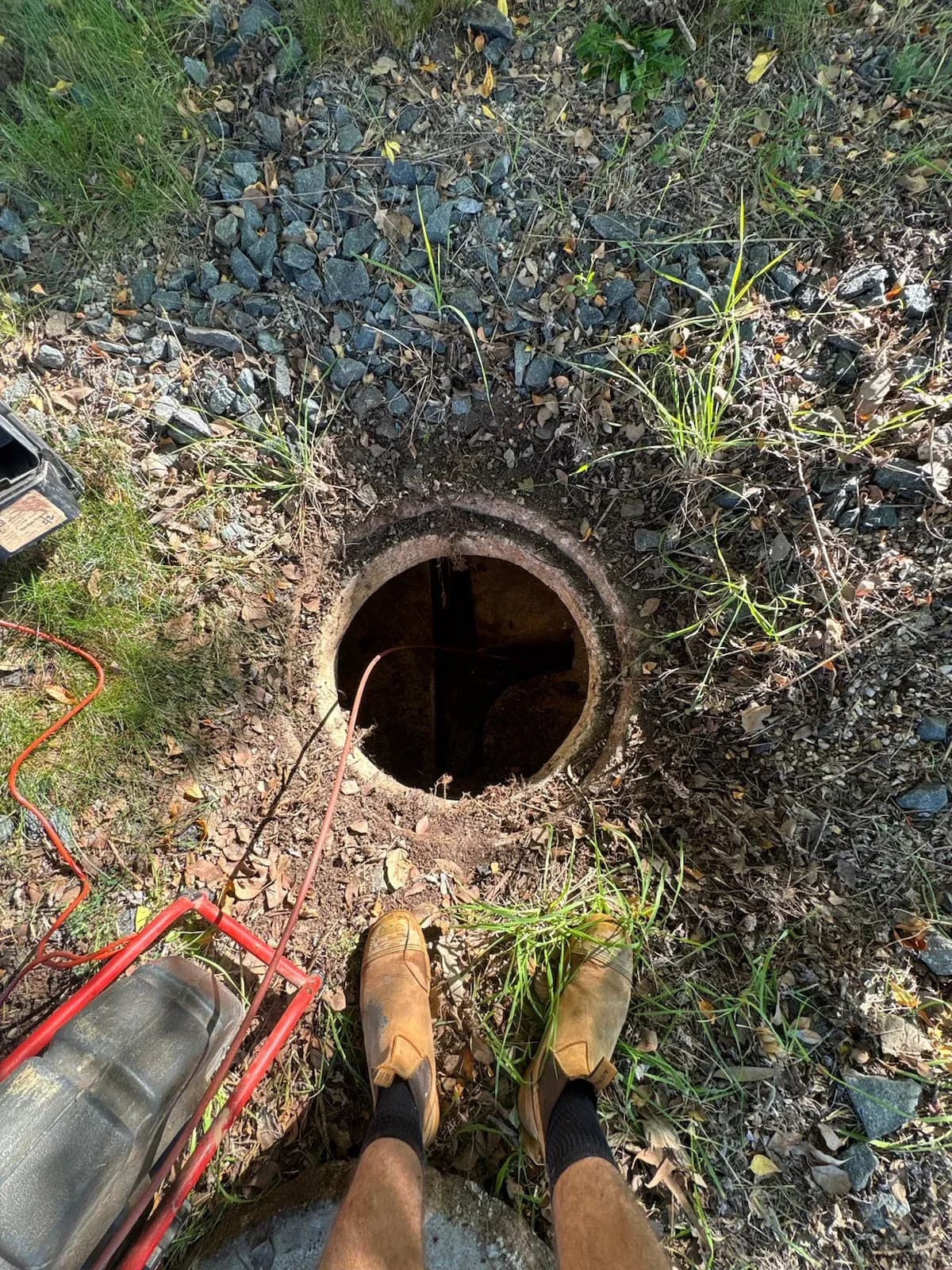 Open sewer access point ready for inspection
