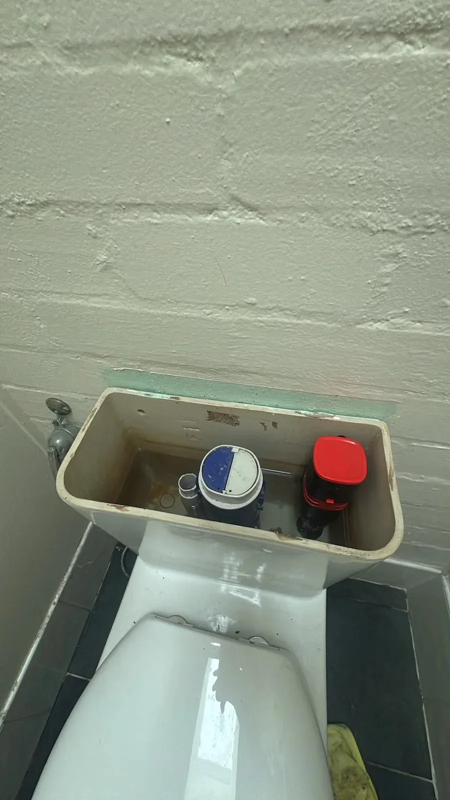 Toilet cistern open for a new inlet valve