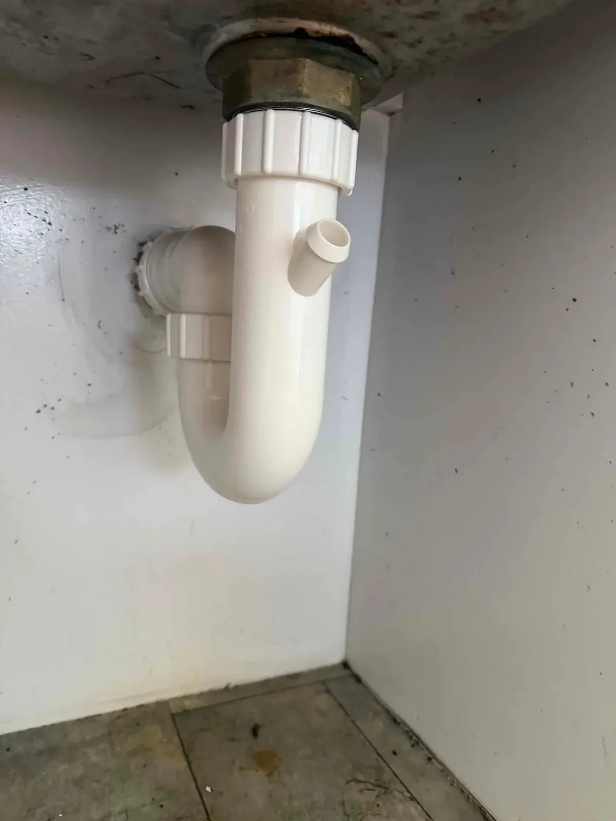New PVC waste pipe under the kitchen sink