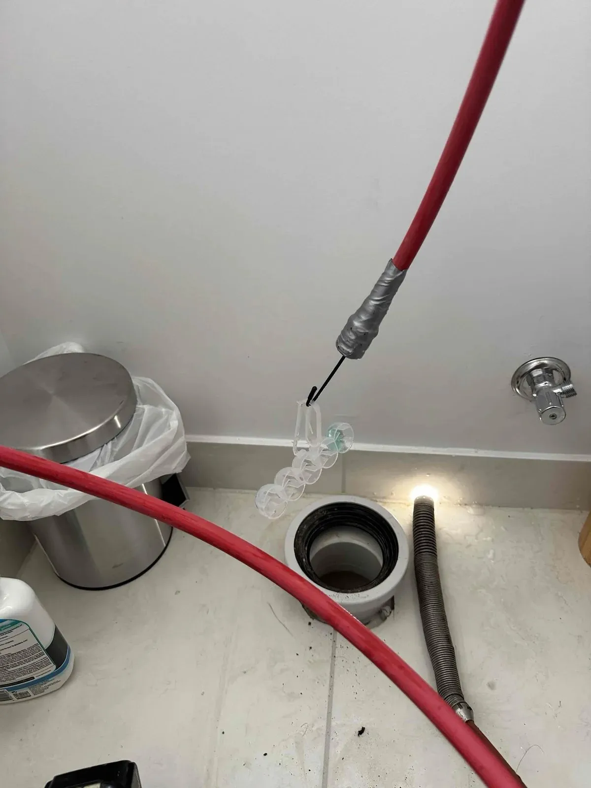 Toilet pan lifted to fish an object out of the drain in Werribee