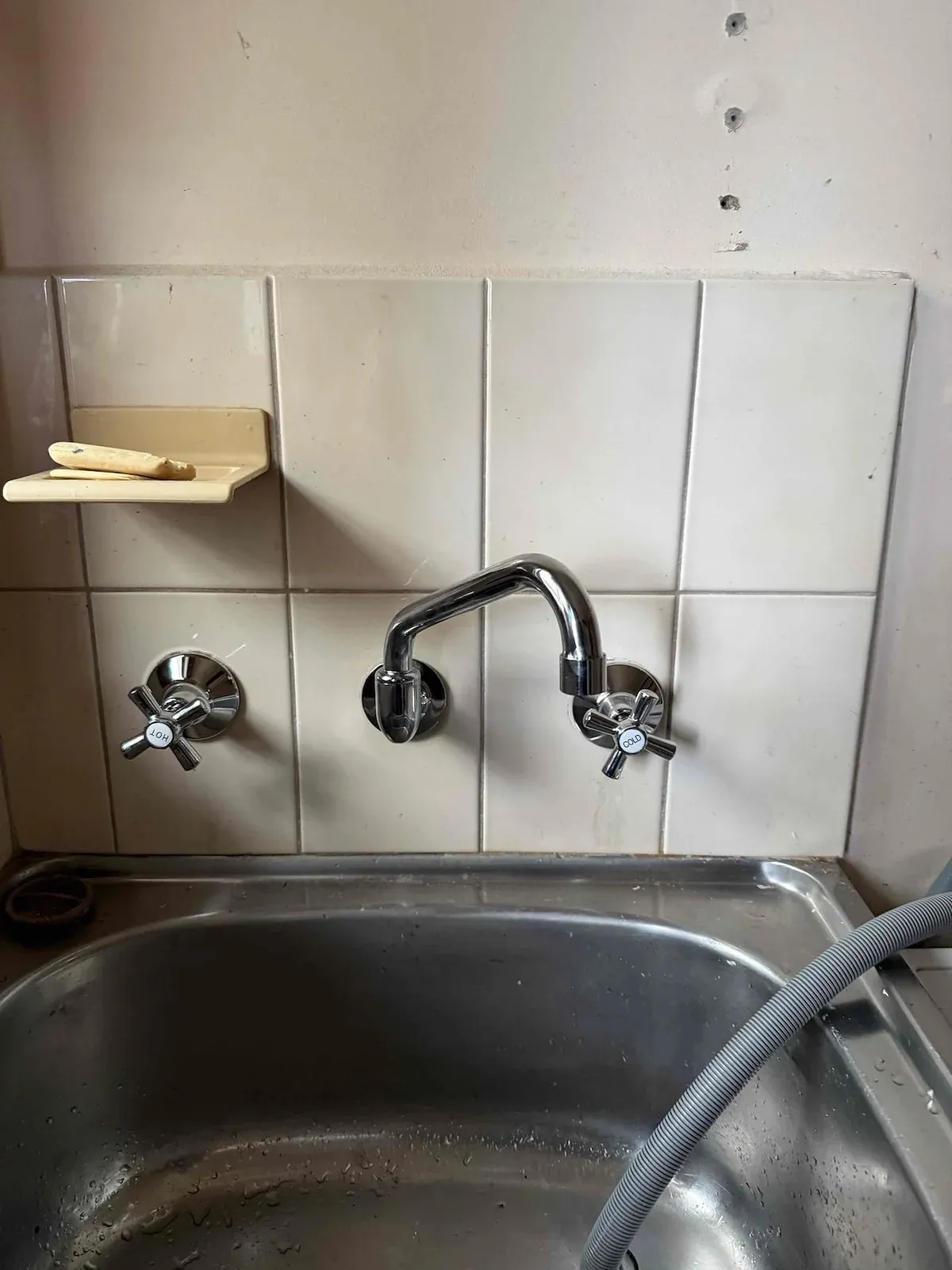 Kitchen sink with new wall tapware