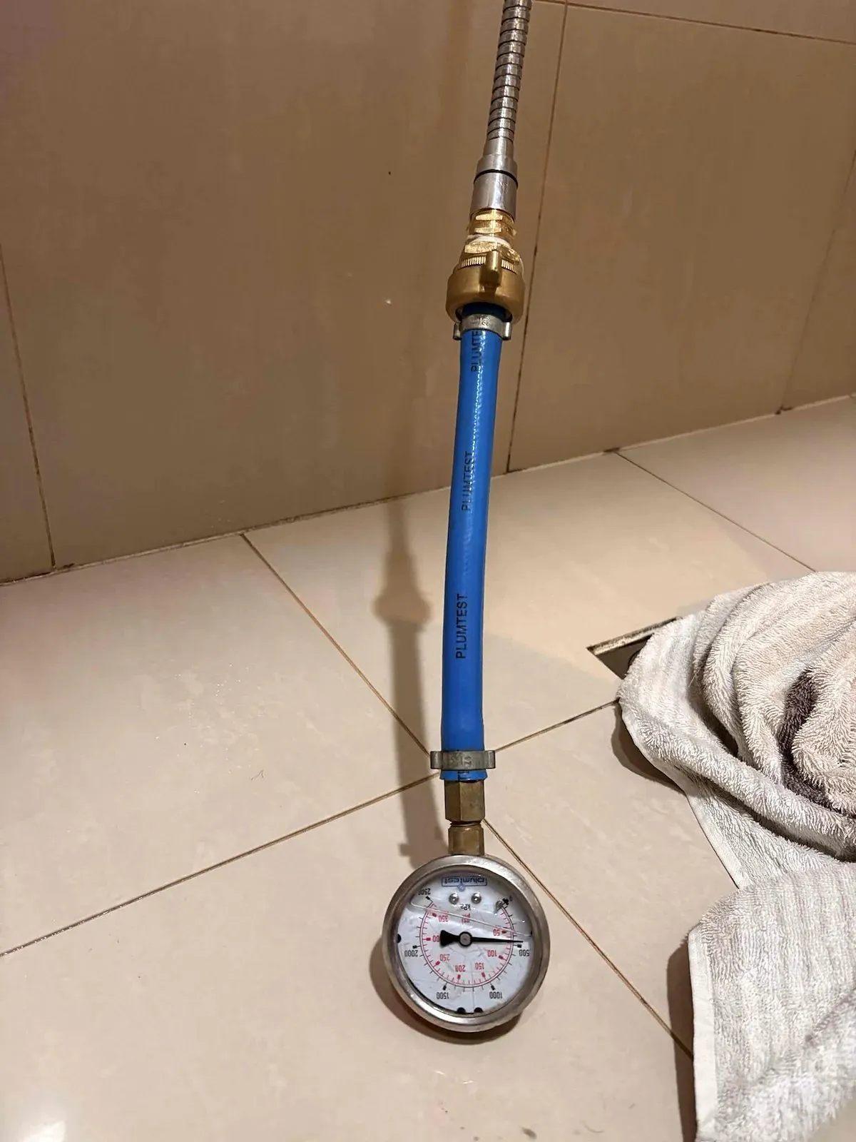 Pressure gauge attached to the water line for testing