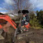 Fix It Right Plumbing Expert Plumber with his son on a digger