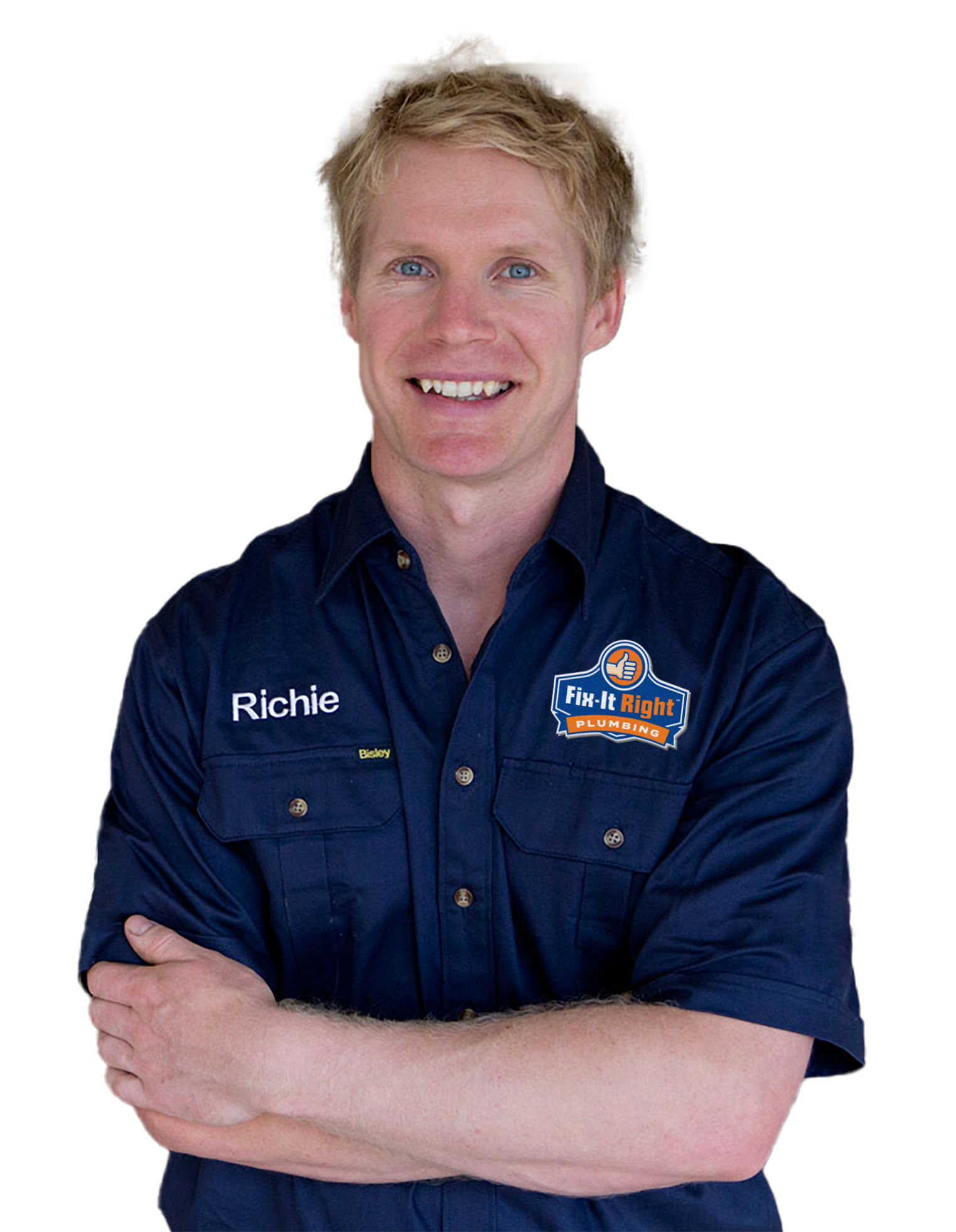 Plumber wearing a navy blue Fix-It Right Plumbing uniform, with the Fix-It Right Plumbing logo, with the name Richie embroidered on it, standing with arms crossed.