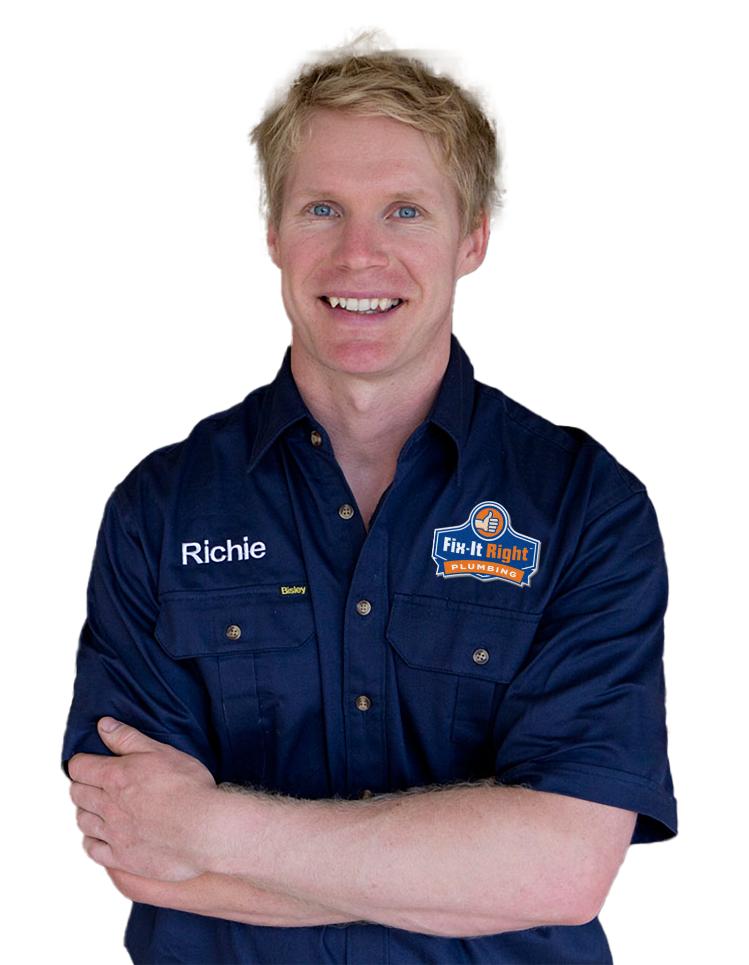 Plumber wearing a navy blue Fix-It Right Plumbing uniform, with the new logo, with the name Richie embroidered on it, standing with arms crossed.