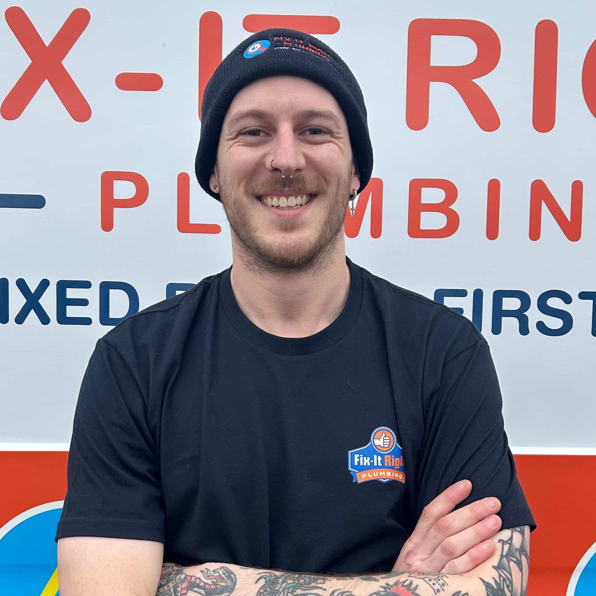 Plumber with new Fix-It Right Plumbing logo on his shirt