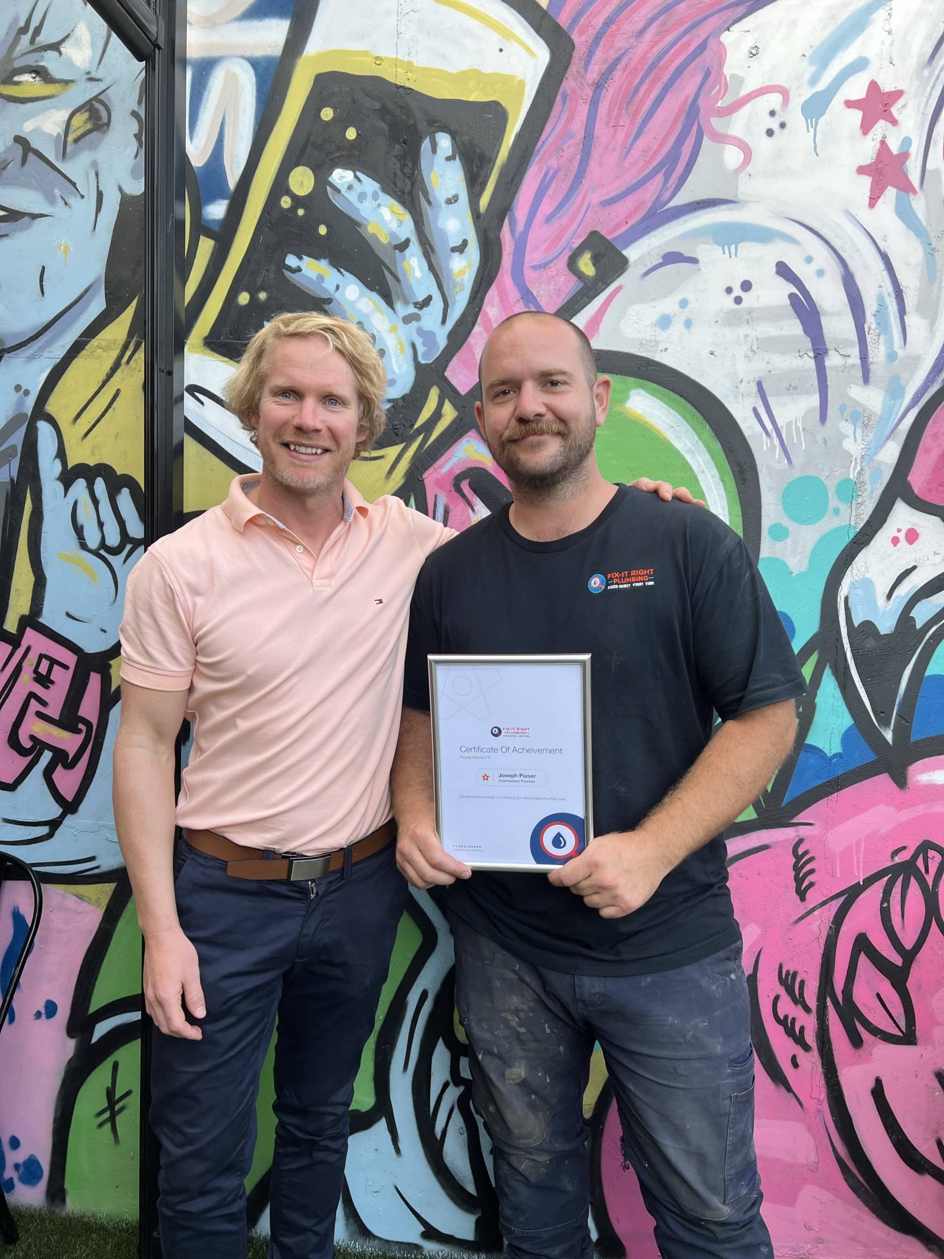 Richard Foster of Fix-It Right Plumbing presents Joseph of Fix-It Right Plumbing Adelaide with an award