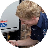 plumber fixing hot water system