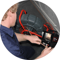 plumber inspecting blocked and clogged drain